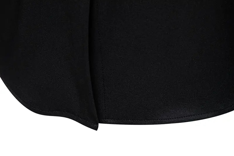 black fabric skirt with smooth matte finish and neatly stitched hem paired with men asymmetrical slant collar long sleeve casual shirt.