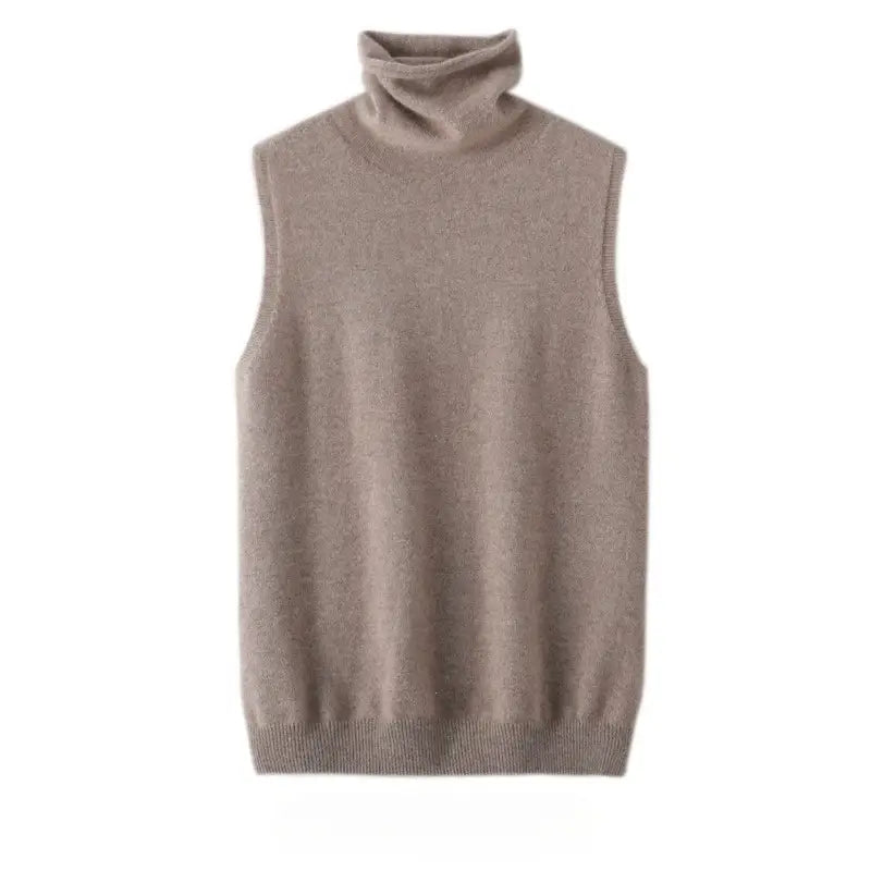 A soft beige merino wool turtleneck vest for women made of fine knit fabric with a ribbed hem and neckline designed as a slim knit base layer.