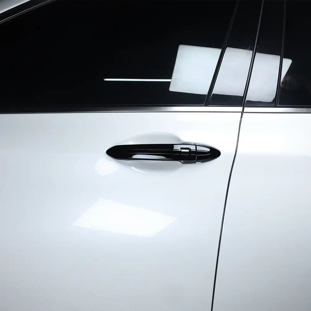 Garniture de protection de poignée de porte en ABS noir brillant pour Genesis G80, illustrée depuis la face arrière, en ensemble de 8 pièces.