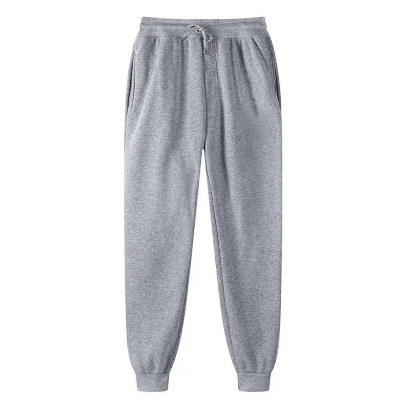 Joggers impresos de hombre estilo casual streetwear en gris jaspeado, con cinturilla ajustable con cordón y puños elásticos, adecuados para el uso diario
