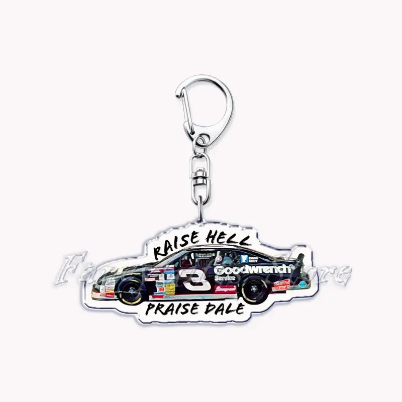 Clear acrylic Nissan Skyline keychain shaped like a white NASCAR race car with number 3 and goodwrench branding featuring raise hell above and praise dale below.