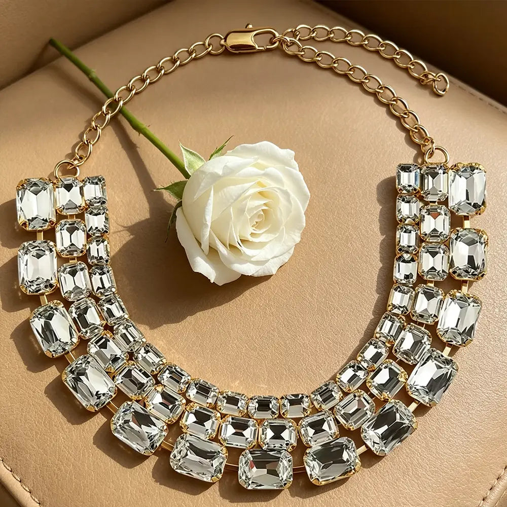 Gold-toned crystal statement choker necklace for women featuring multiple rows of clear faceted crystals in a bold collar design.