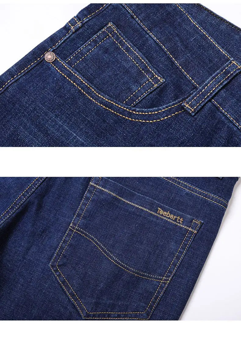 The back side of men’s dark blue stretch cotton straight jeans with light beige stitching and a Teehartt brand label on the pocket casual trousers.