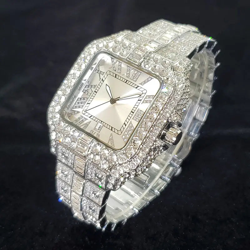 A dazzling silver blue iced out diamond square watch for men featuring a silver-toned square face with roman numeral hour markers and an intricate band encrusted in sparkling diamonds.