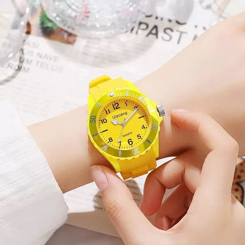 Bright yellow kids silicone quartz watch with a matching dial, silver-tone hands, and the brand name uizcang on its face.