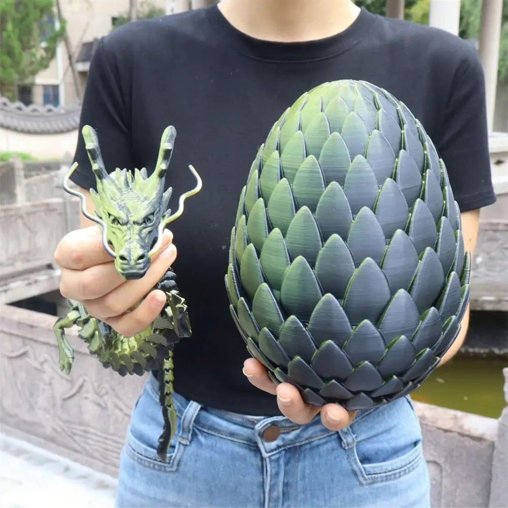 a 3d printed giant dragon egg with a gradient green-to-black finish and detailed ridged texture shown from the front angle