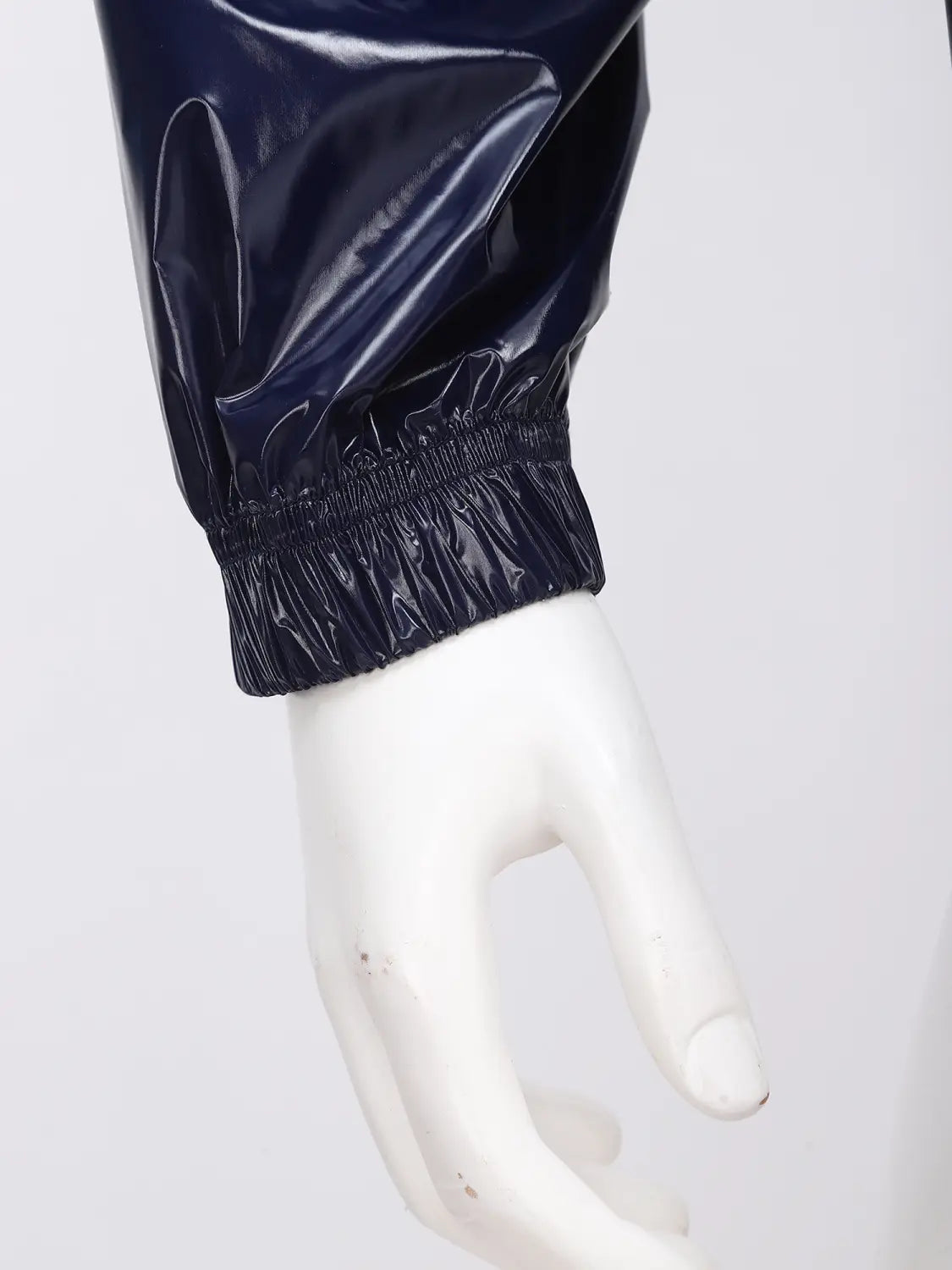 Navy blue glossy nylon sleeve with elasticated cuff of men waterproof hooded windbreaker jacket.