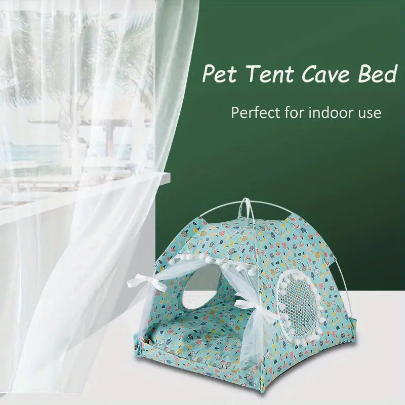 A light blue pet tent floral print cave bed for cats and dogs featuring a playful pattern of small animals and objects with white mesh ventilation and decorative pom-poms along the edges.