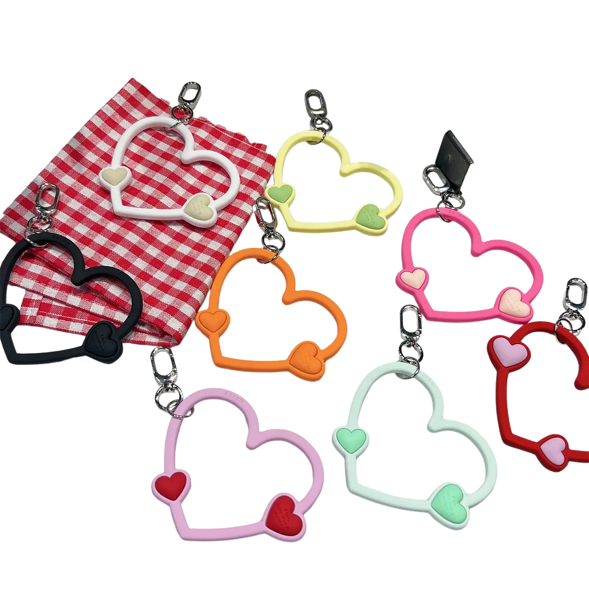 Colorful heart-shaped silicone phone wrist strap with matching inner hearts and silver metal clasp for ins phone wrist use