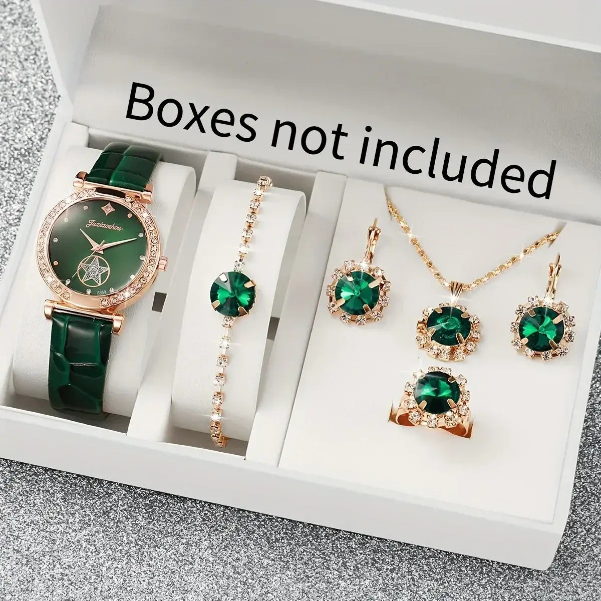 Emerald green and rose gold watch with an emerald dial and matching jewelry set for women featuring earrings, necklace, bracelet, and ring adorned with sparkling crystals.