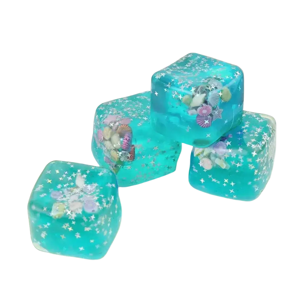 Turquoise translucent gel ice cubes with seashells and starfish as a thoughtful gift ocean sensory fidget cube