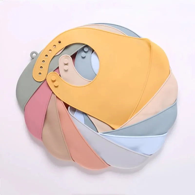 The baby feeding bib is made of silicone and has a water-resistant design. It is suitable for feeding purposes.