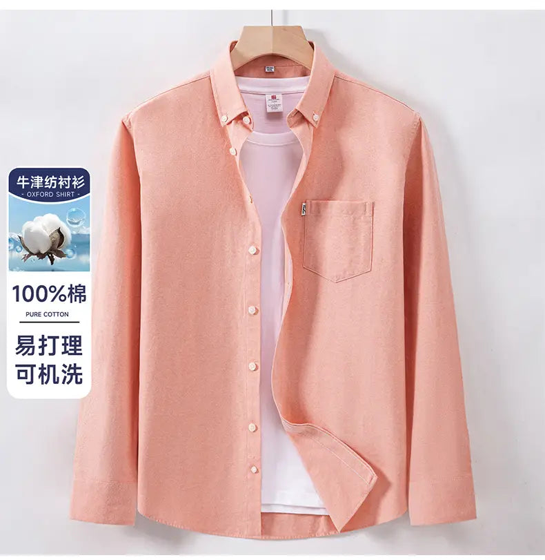 A soft peach-colored men cotton oxford long sleeve casual shirt made of 100% pure cotton featuring a classic button-down collar and front placket.