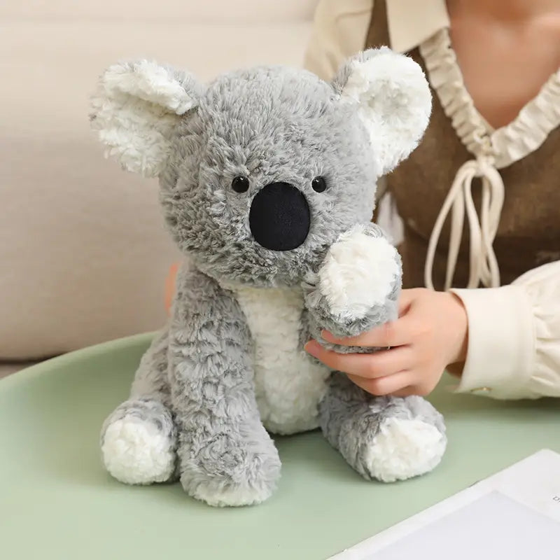 a plush stuffed animal toy koala 25cm with soft plush gray and white fur black button eyes large black nose and fluffy ears