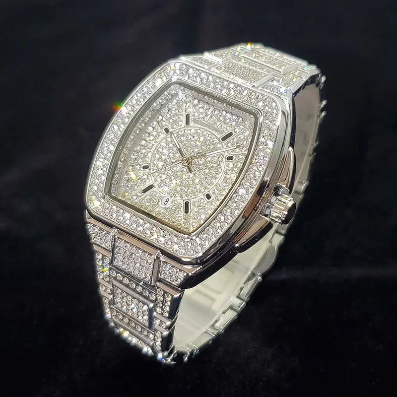 A dazzling silver gold iced out square diamond mens watch with a quartz movement featuring a band and square face encrusted in sparkling clear crystals.