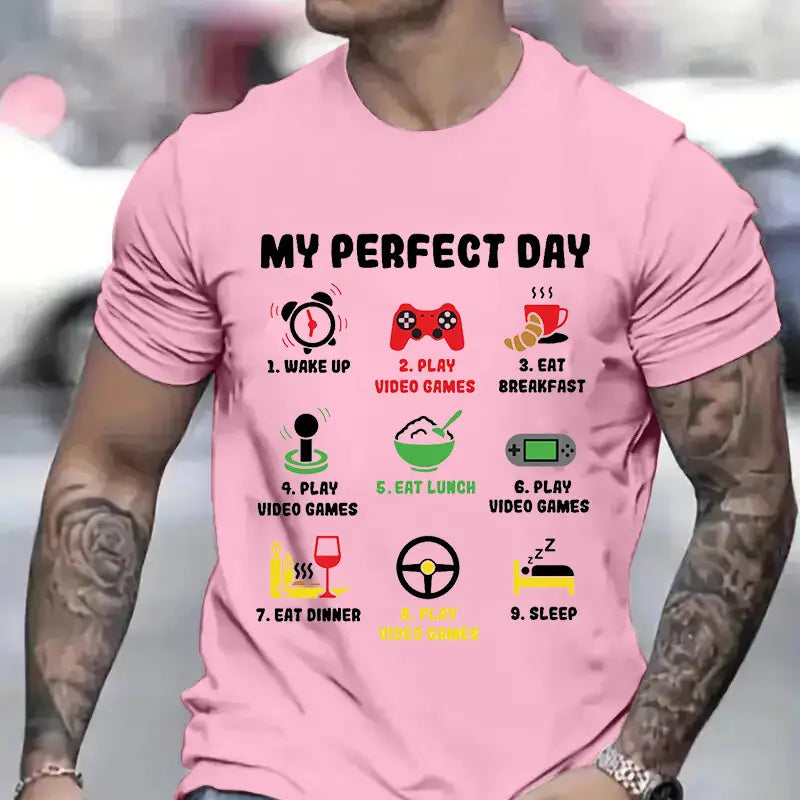 Rosa kurzärmeliges Baumwoll-Gamer-Perfekt-Tag-Grafik-T-Shirt für Herren mit einem Tagesablauf-Aufdruck mit Symbolen für das Aufwachen, das Spielen von Videospielen, das Einnehmen von Mahlzeiten und das Schlafen.