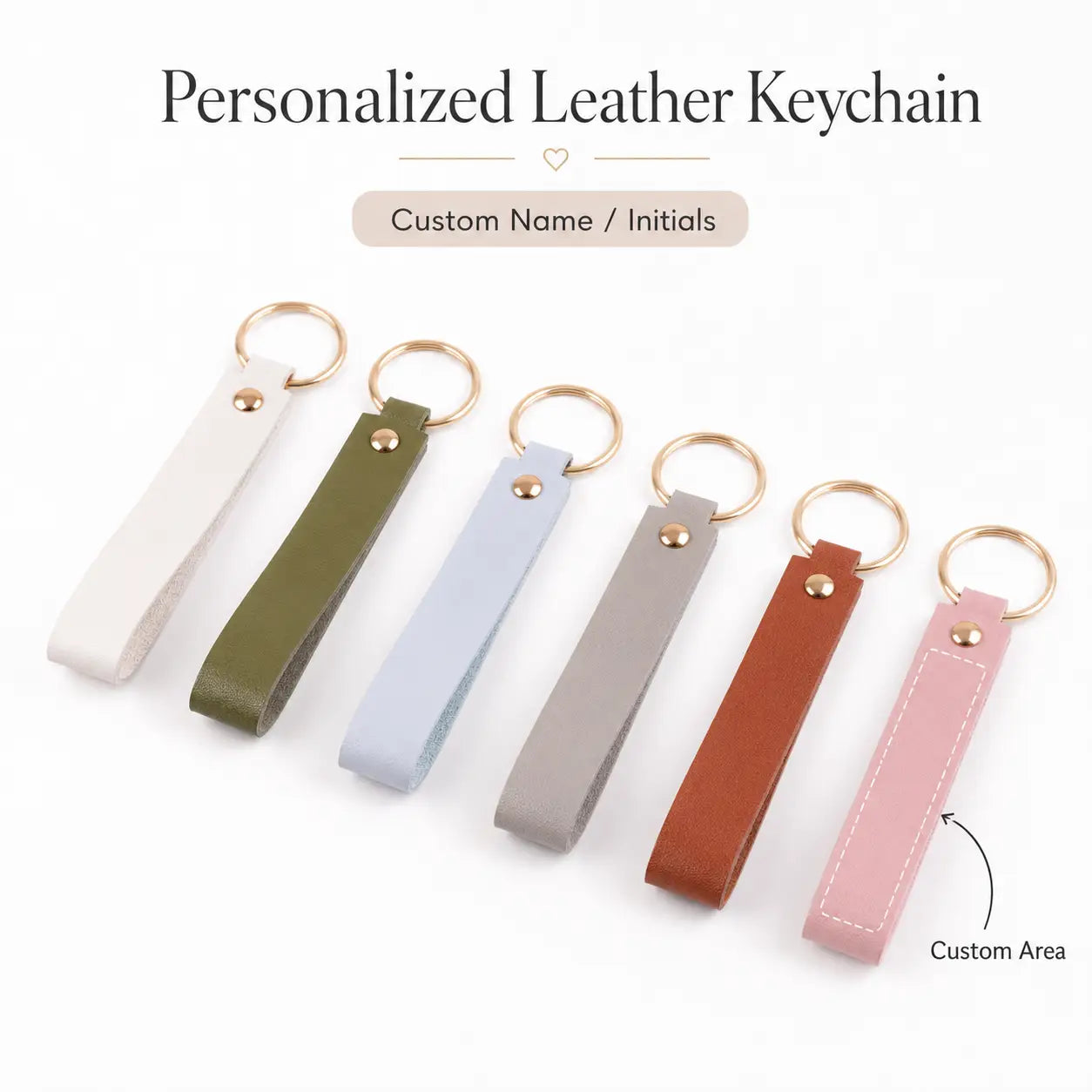 A collection of custom name pink leather keychains and other personalized leather keychains in white olive green light blue gray brown and pink colors.