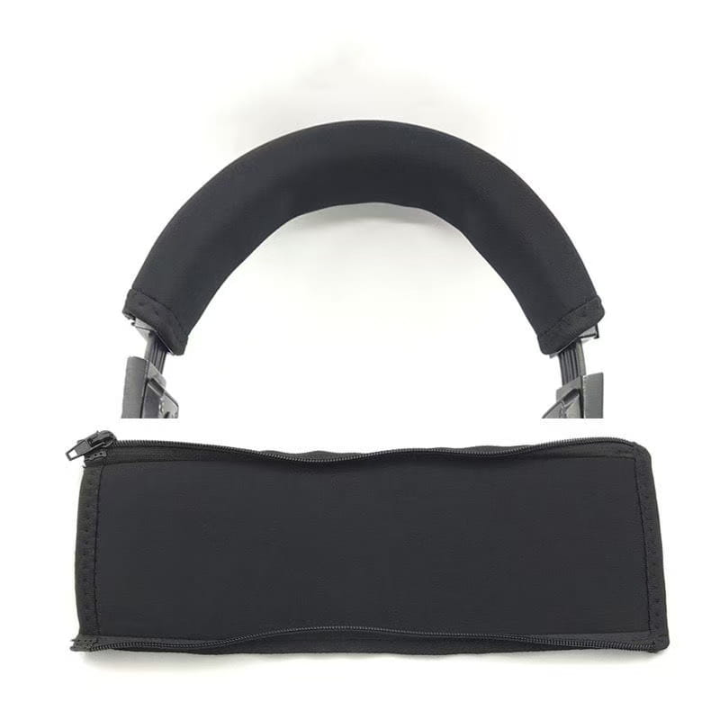 Black neoprene headphone headband cover with zipper closure and padded cushioning for comfortable wear.