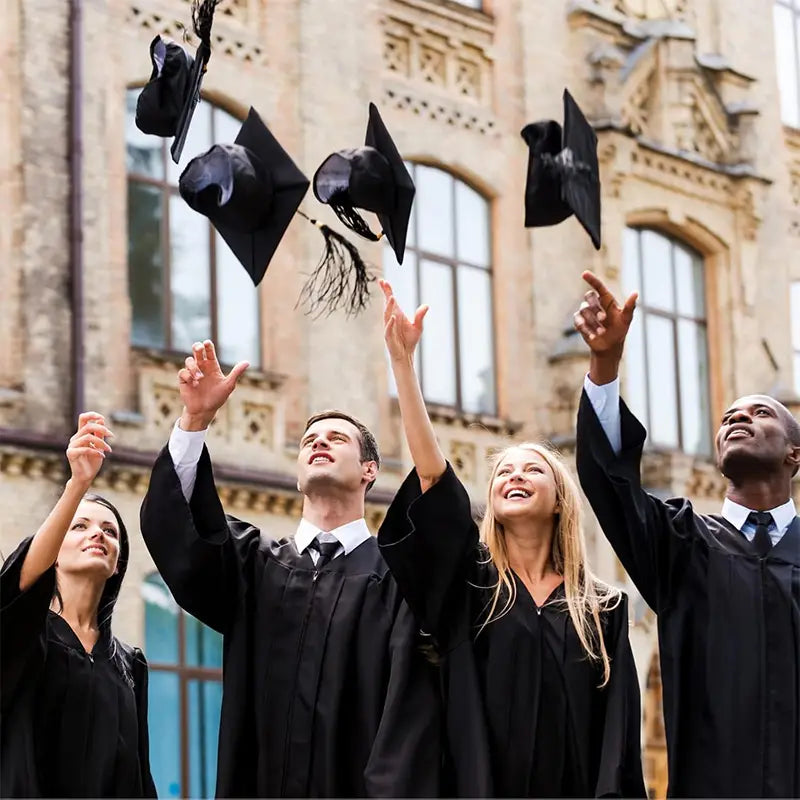 Black adult graduation caps with tassels made of fabric suspended in mid-air for 2025 ceremonies