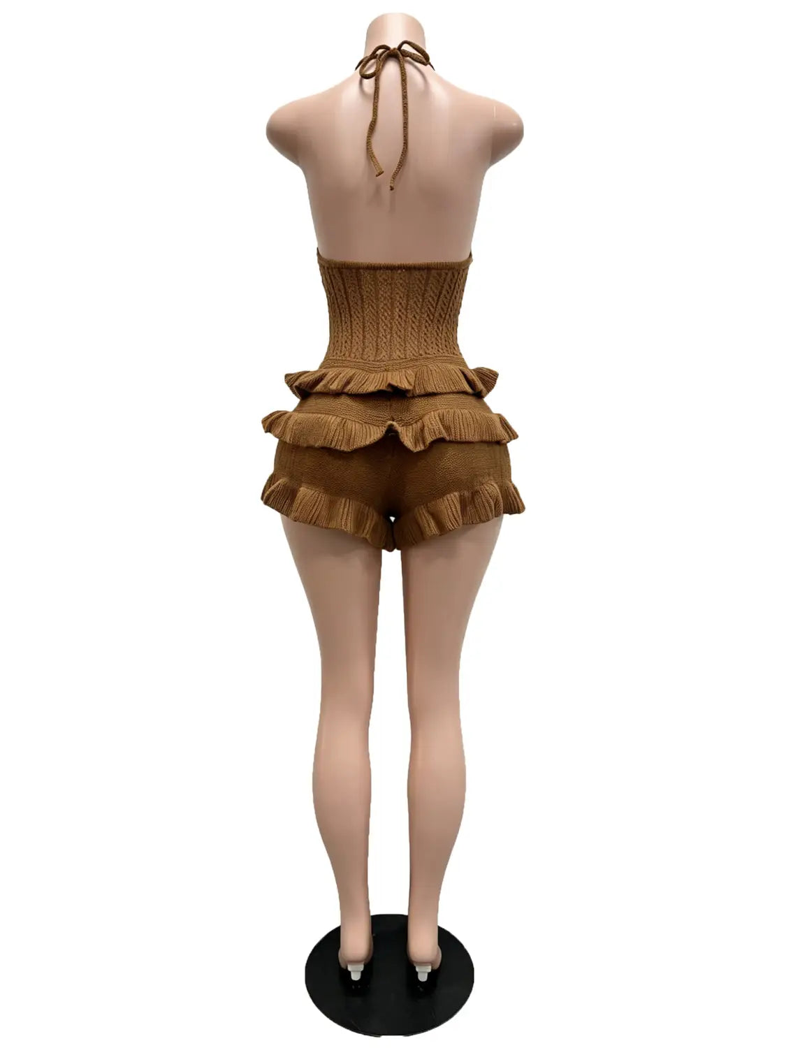 a tan knitted ruffle halter romper summer playsuit displayed on a mannequin featuring a halter top and ruffled shorts