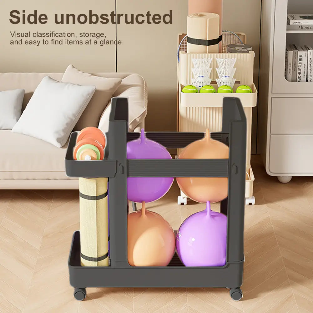 Black plastic rolling gym equipment storage cart with wheels featuring multiple compartments holding colorful exercise balls