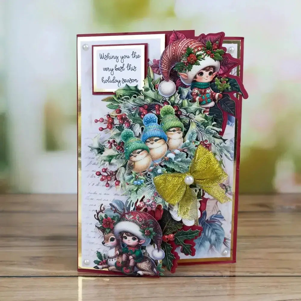 a christmas metal cutting die and stamp set featuring a festive holiday card design with whimsical elf and reindeer characters in red green gold and blue accents
