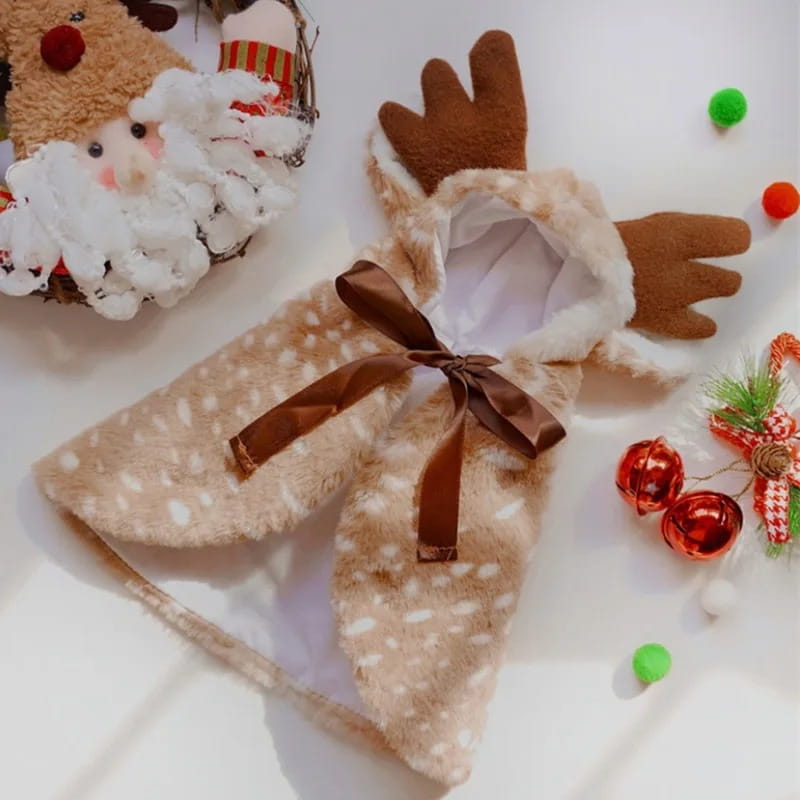 A plush beige reindeer-themed pet dog coat with white polka dots and brown antlers featuring a matching bow at the front designed for winter use in pet dog clothes.