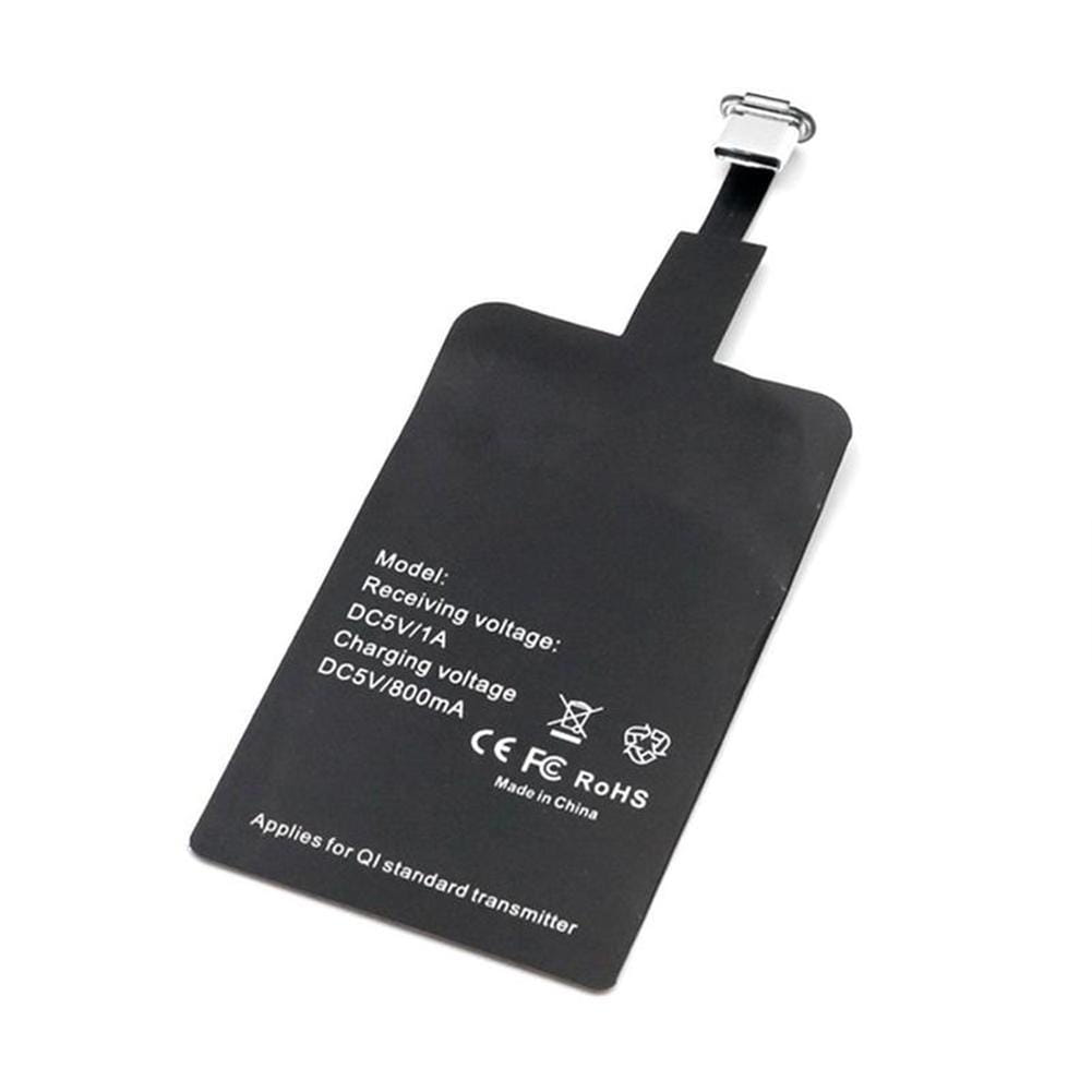 Black wireless charging receiver pad for type c android phones with metallic clasp and white specification text on back side used for wireless charging