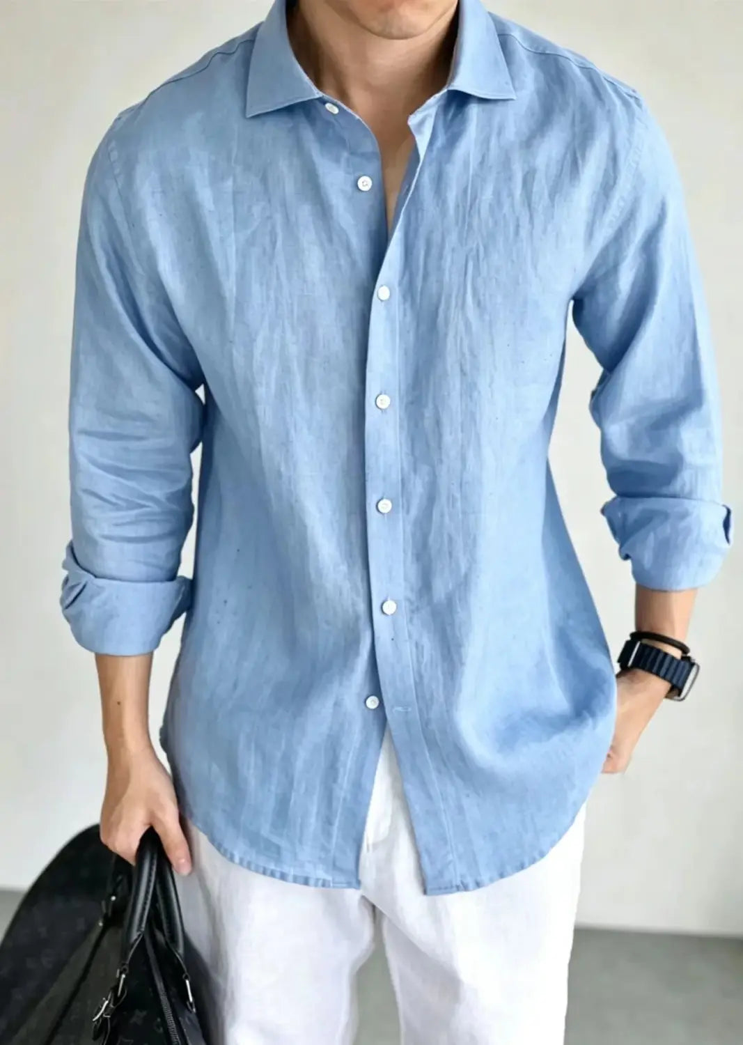 Men cotton linen casual button down shirt in light blue with rolled-up sleeves and white buttons.