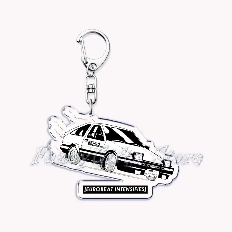 Silver acrylic Nissan Skyline car keychain featuring a black-and-white illustration of a classic ae86 Toyota Corolla with racing decals and the text eurobeat intensifies below.