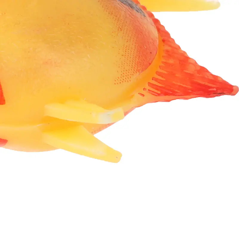 A vibrant yellow and orange plastic floating fish toy with textured fins designed for aquarium fish decoration in a moving floating fish 10 pack.