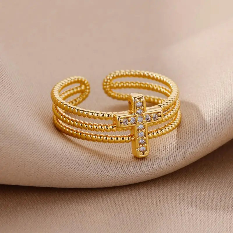 Anillo abierto de acero inoxidable color dorado para mujeres, con diseño de triple tira con cuentas y un motivo central en forma de cruz adornado con piedras de circonia cúbica transparentes, joyería de boda vintage.