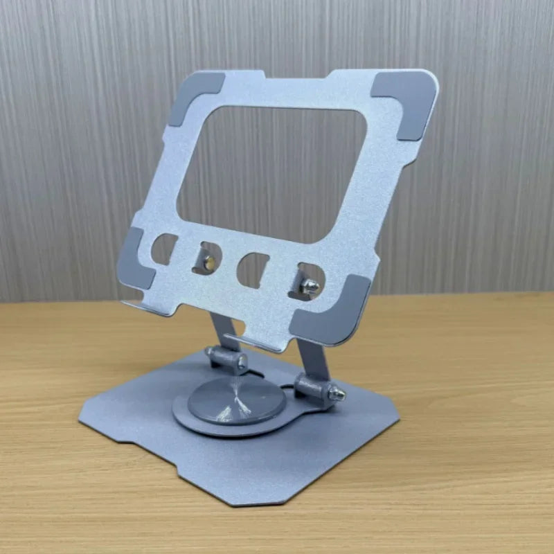 silver metallic metal tablet stand with a sleek angular design and adjustable hinge mechanism is 360 rotatable and foldable