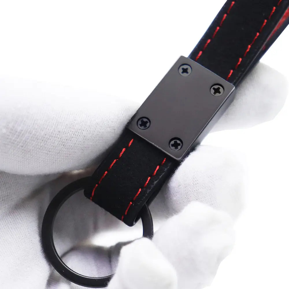 black leather car keychain with red stitching and a matte black metal plate for jac leather car keychain red stitching product