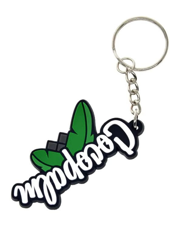 Custom soft pvc keychain made of green and black rubber featuring white cursive cannabene lettering and a stylized cannabis leaf design.