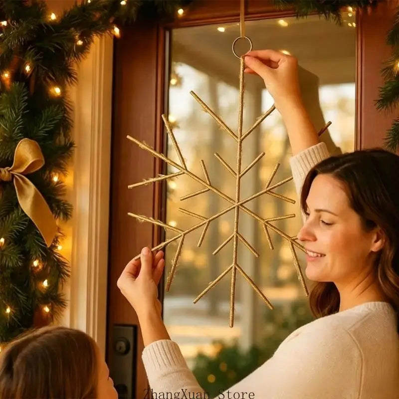 Gold glittery snowflake Christmas tree and wreath ornament made of twigs with a hanging loop.