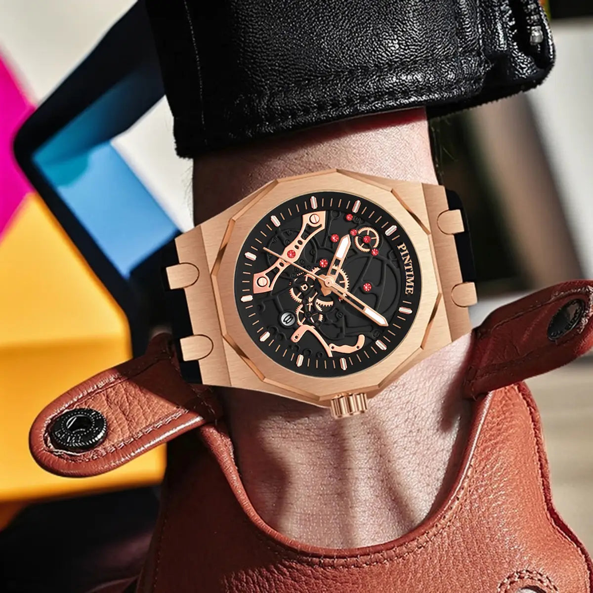 Pintime men luxury skeleton quartz watch featuring a rose gold case, black dial with red accent details, and a brown leather strap.