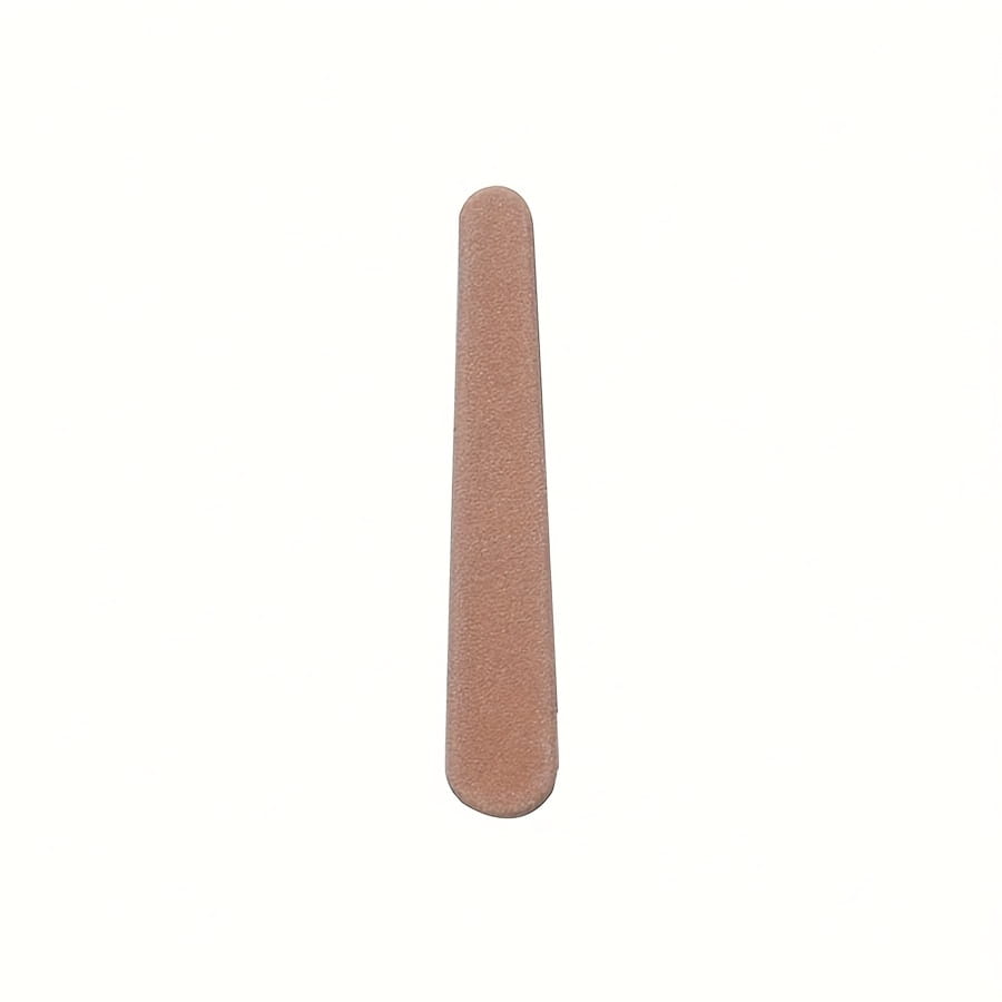 Beige rectangular wooden nail file with a textured slightly rough surface from a baby wooden grooming set and healthcare kit.