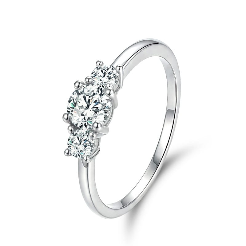 Elegant sterling silver zircon ring for women featuring a three-stone design with a central round-cut diamond flanked by two smaller stones securely set in prongs.