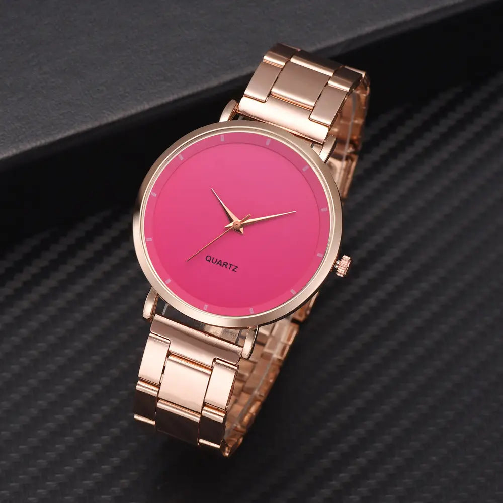 Rose gold women luxury watch quartz business wristwatch with rose gold-tone stainless steel and vibrant pink dial featuring a minimalist design.
