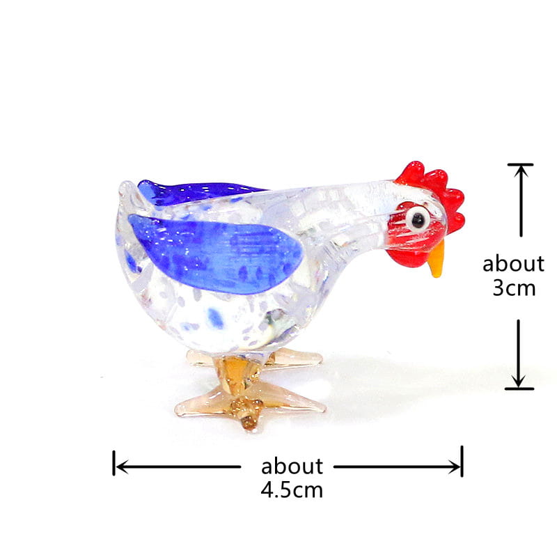 A translucent glass rooster miniature figurine Easter ornament with a vibrant blue wing red comb and clear amber legs.
