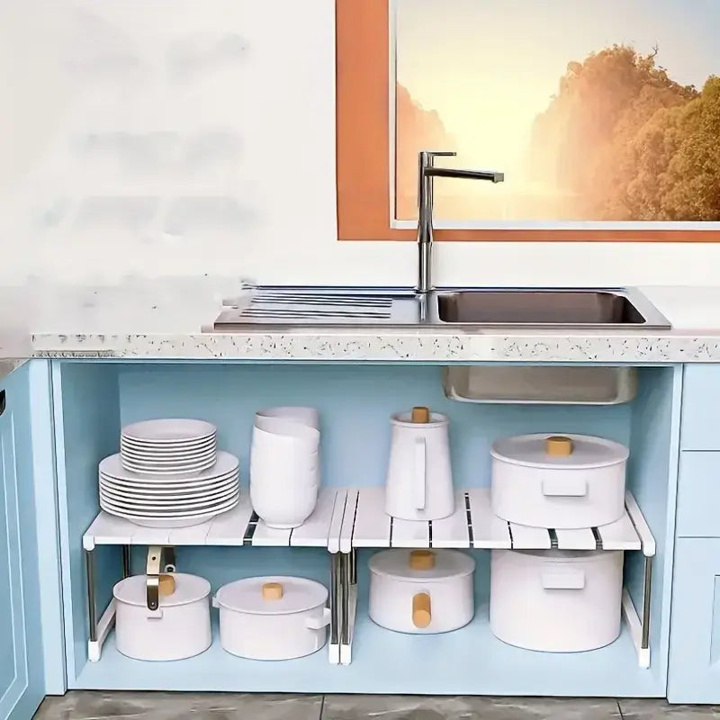 white ceramic pots with wooden lids arranged on a metal and white plastic telescopic sink holder layered partition rack under the sink