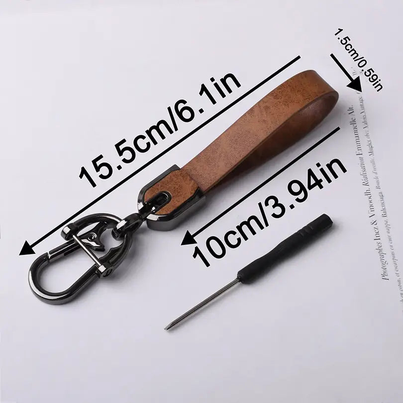 Brown leather custom engraved keychain with a black metal carabiner and clasp for personalized car key ring use.
