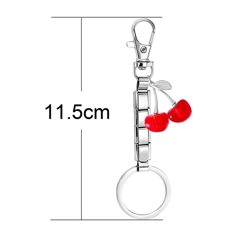 Llavero con dije de eslabones italianos con acabado plateado, con un diseño de cadena segmentada elegante y dos dijes de cerezas rojas brillantes para uso personalizado en bricolaje.