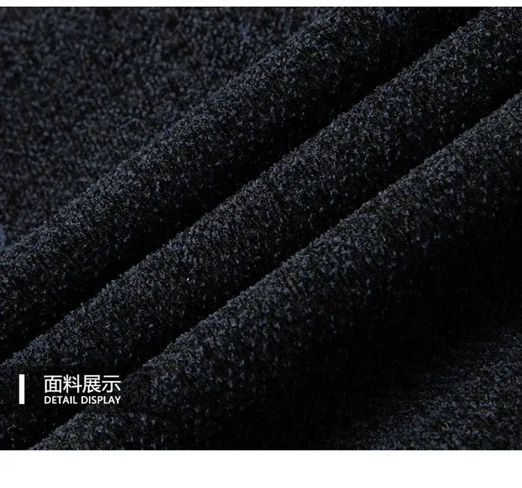 Dark gray textured knit fabric with a soft slightly fuzzy surface used in a men wool blend winter trench coat.