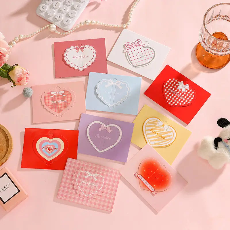 a set of pastel-colored 3d heart greeting cards featuring delicate lace and ribbon bow designs with best wishes printed on them for valentine and wedding notes