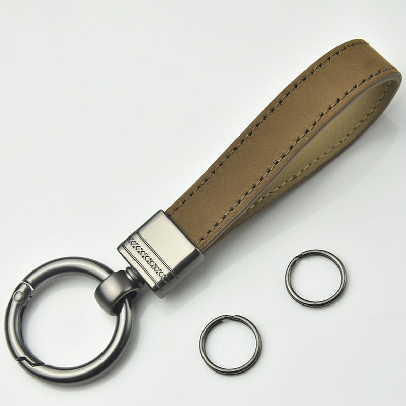 Tan leather keychain with multicolor three circular metal rings and a metallic clasp in the leather keychains set multicolor metal clasp.