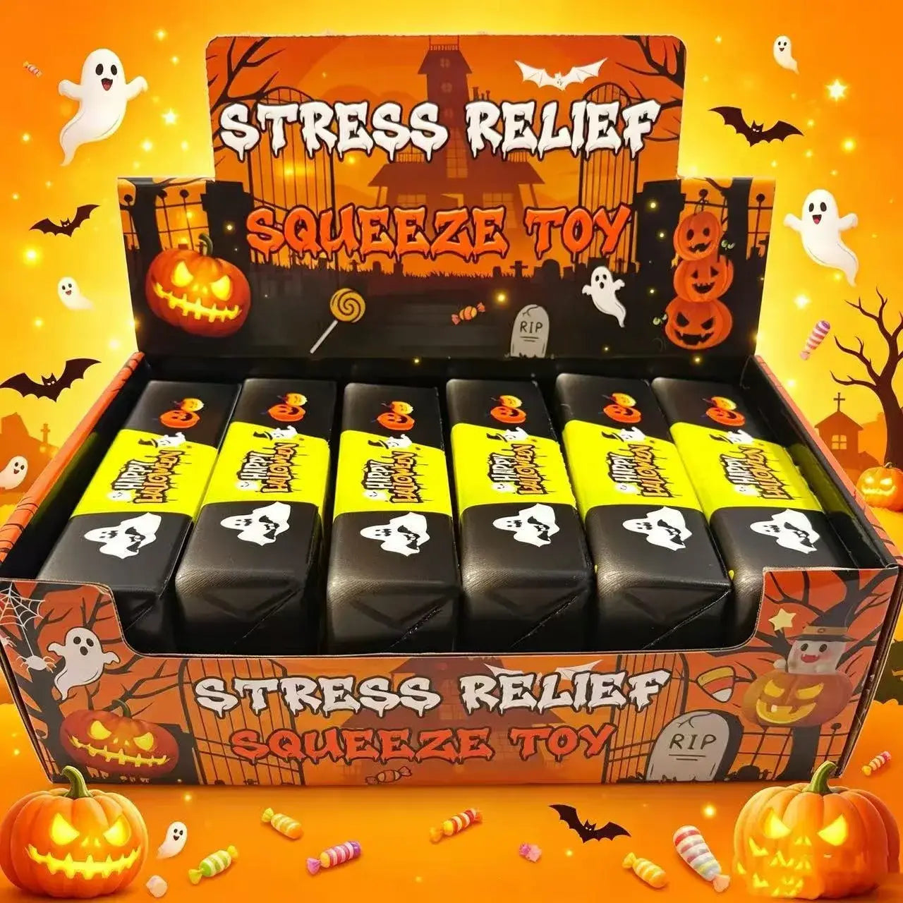 Schwarze und gelbe Halloween- langsam ansteigende Butter-Quetschtiere, in einer Box ausgestellt, die für Stresslinderung und sensorisches Spiel gestaltet ist.