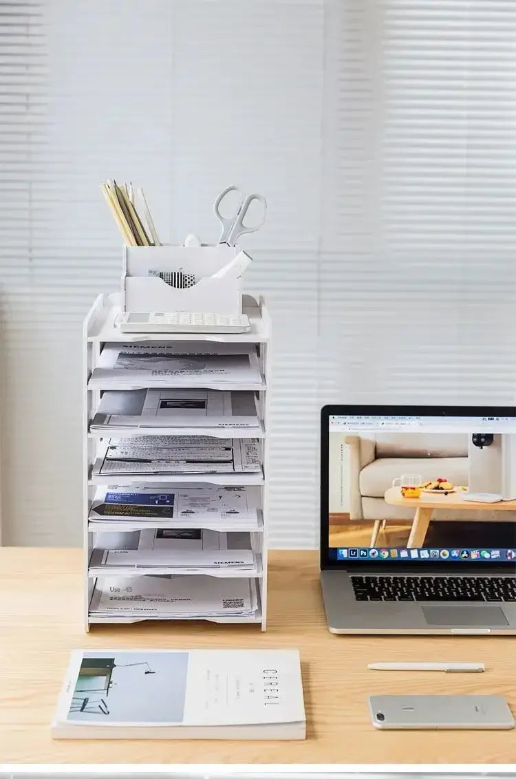 White plastic multi-tiered desktop file organizer and storage rack with stacked compartments holding papers keyboard tray and office supplies.