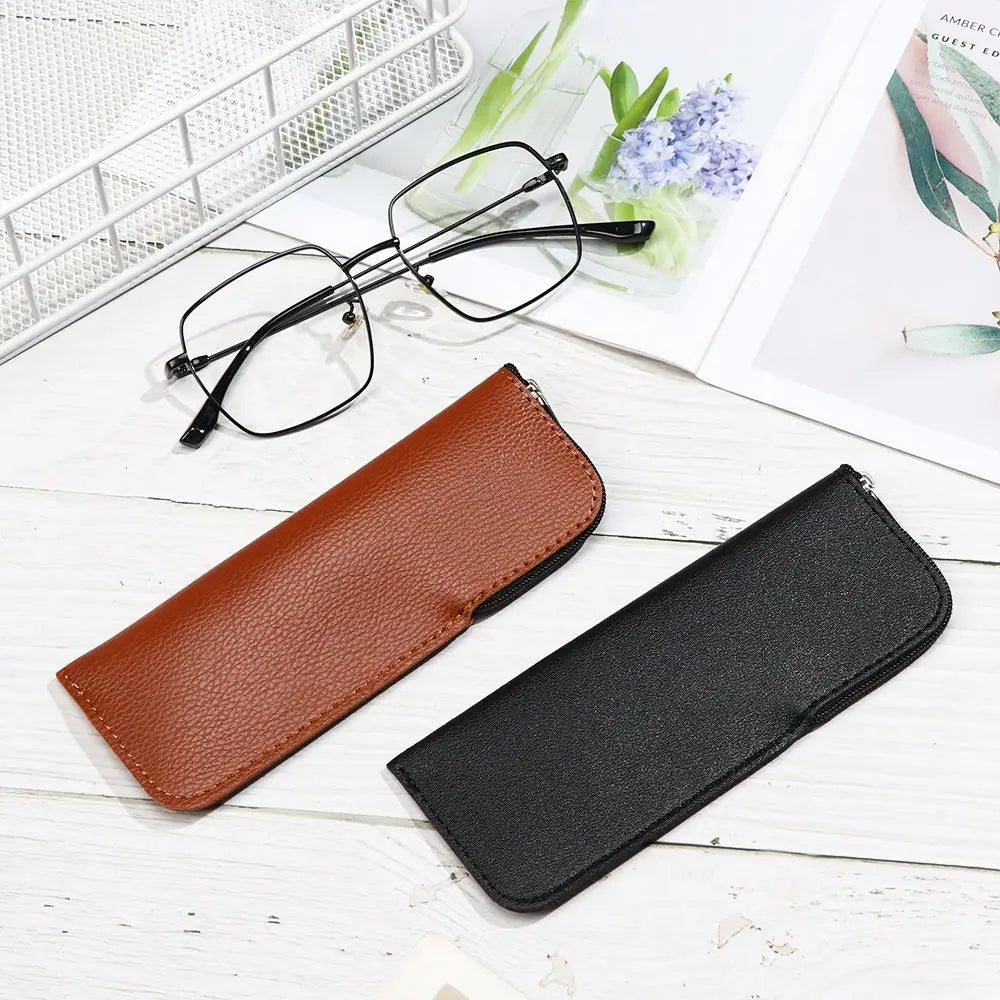 braune und schwarze Ledertasche für Brillen mit Reißverschluss, ausgelegt als robustes Brillenaccessoire